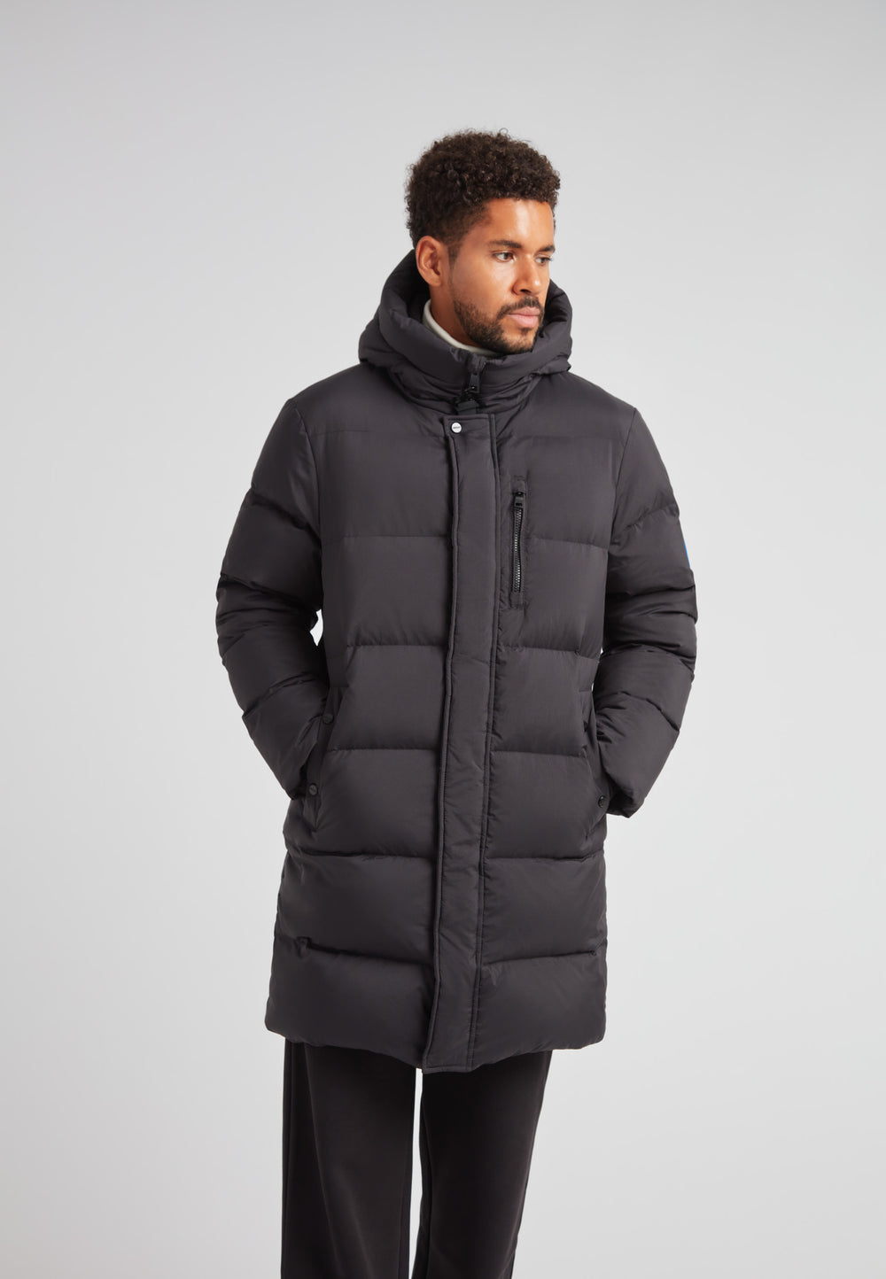 Down Parka Coat for Men in Black, featuring a hood and padded design for winter protection.