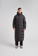 Mens Extra Long Puffer Coat in Black worn by a model, showcasing a sleek and warm winter design.