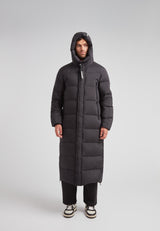 Mens Extra Long Puffer Coat in Black worn by model, showcasing its stylish and warm design.