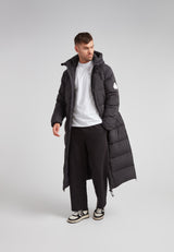 Mens Extra Long Puffer Coat in Black worn by model, showcasing full-body winter protection.