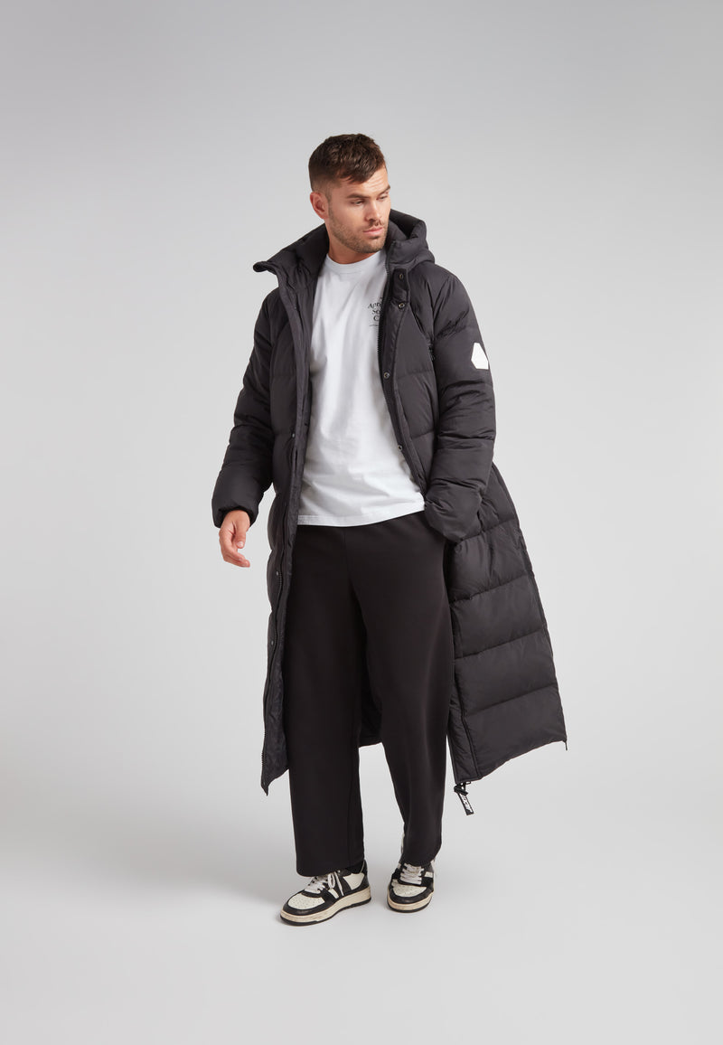 Mens Extra Long Puffer Coat in Black worn by model, showcasing full-body winter protection.