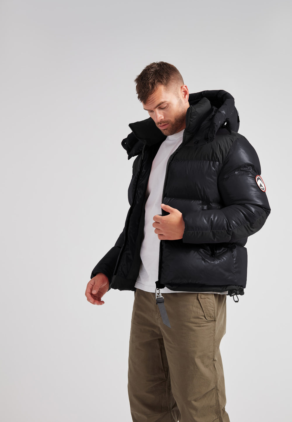 Expedition Parka Puffer Men Black model wearing oversized black puffer jacket with hood