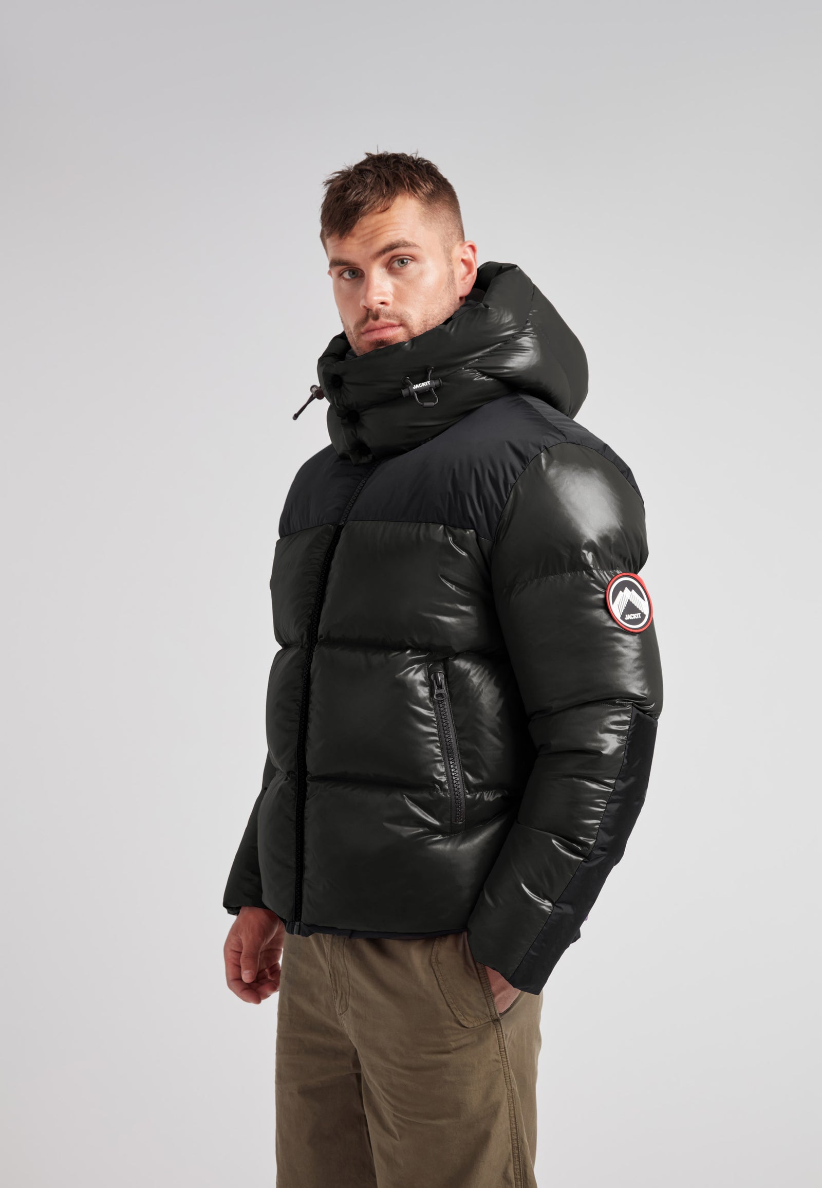 Expedition Parka Puffer Men Emerald stylish side view showcasing the oversized hood and boxy silhouette.