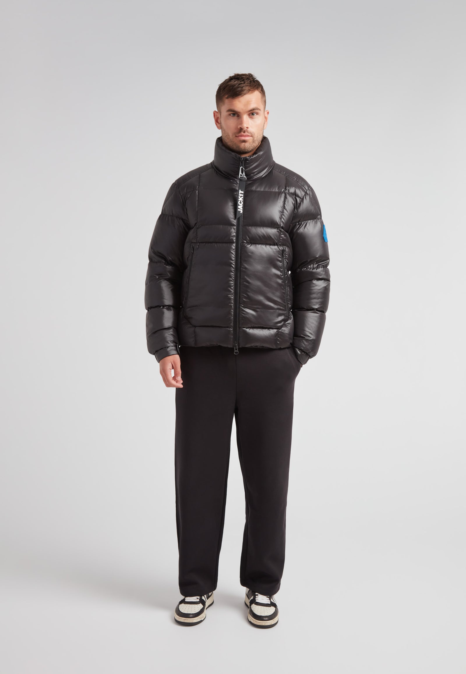 Man wearing EZ Boxed Funnel Puffer Jacket Lux Black, showcasing a sleek winter-ready style.