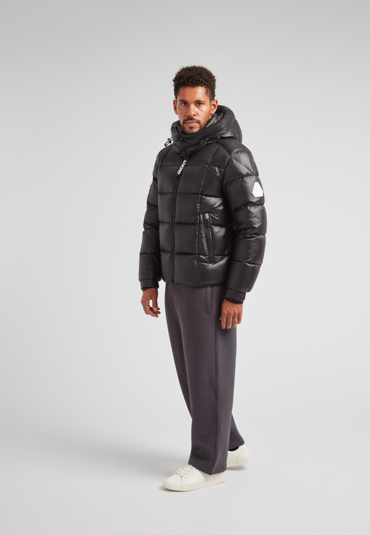 Model wearing EZ Boxed Puffer Racer Jacket Lux Black with structured style, perfect for urban cold-weather protection.