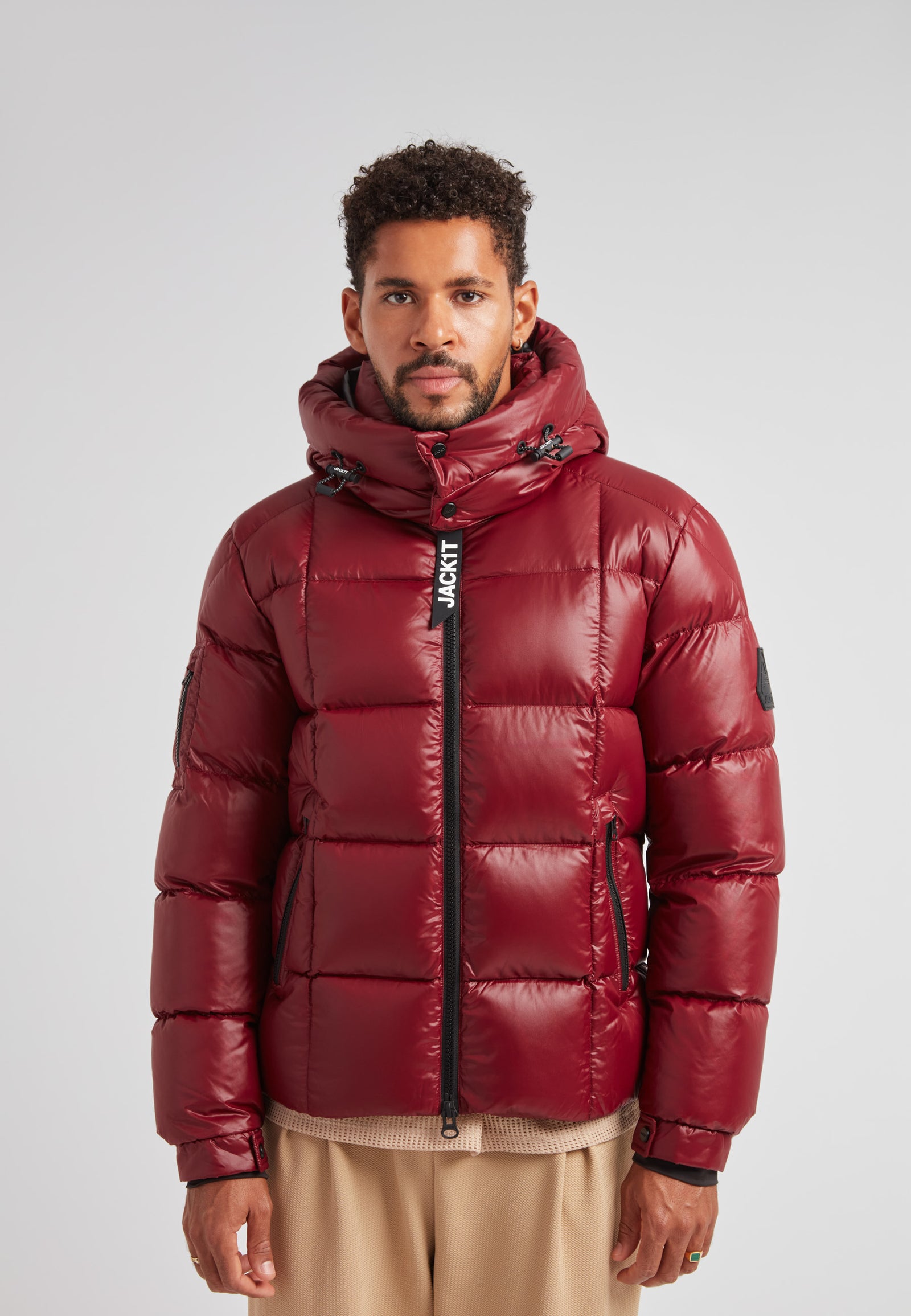 EZ Boxed Puffer Racer Jacket Lux Red showcased on a model, featuring a sleek design and cozy insulation.