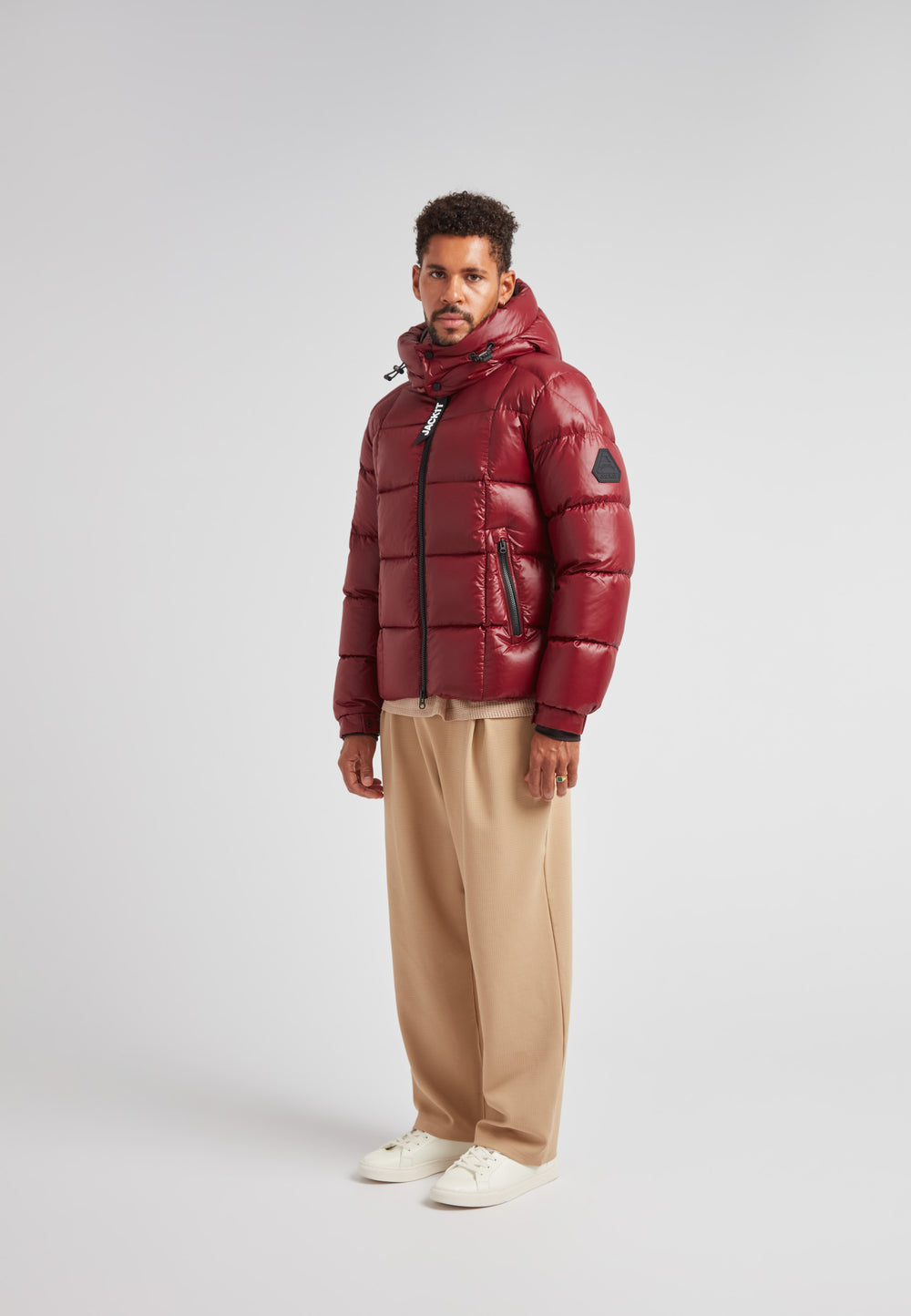 EZ Boxed Puffer Racer Jacket Lux Red displayed on a model, showcasing its insulated design and stylish silhouette.