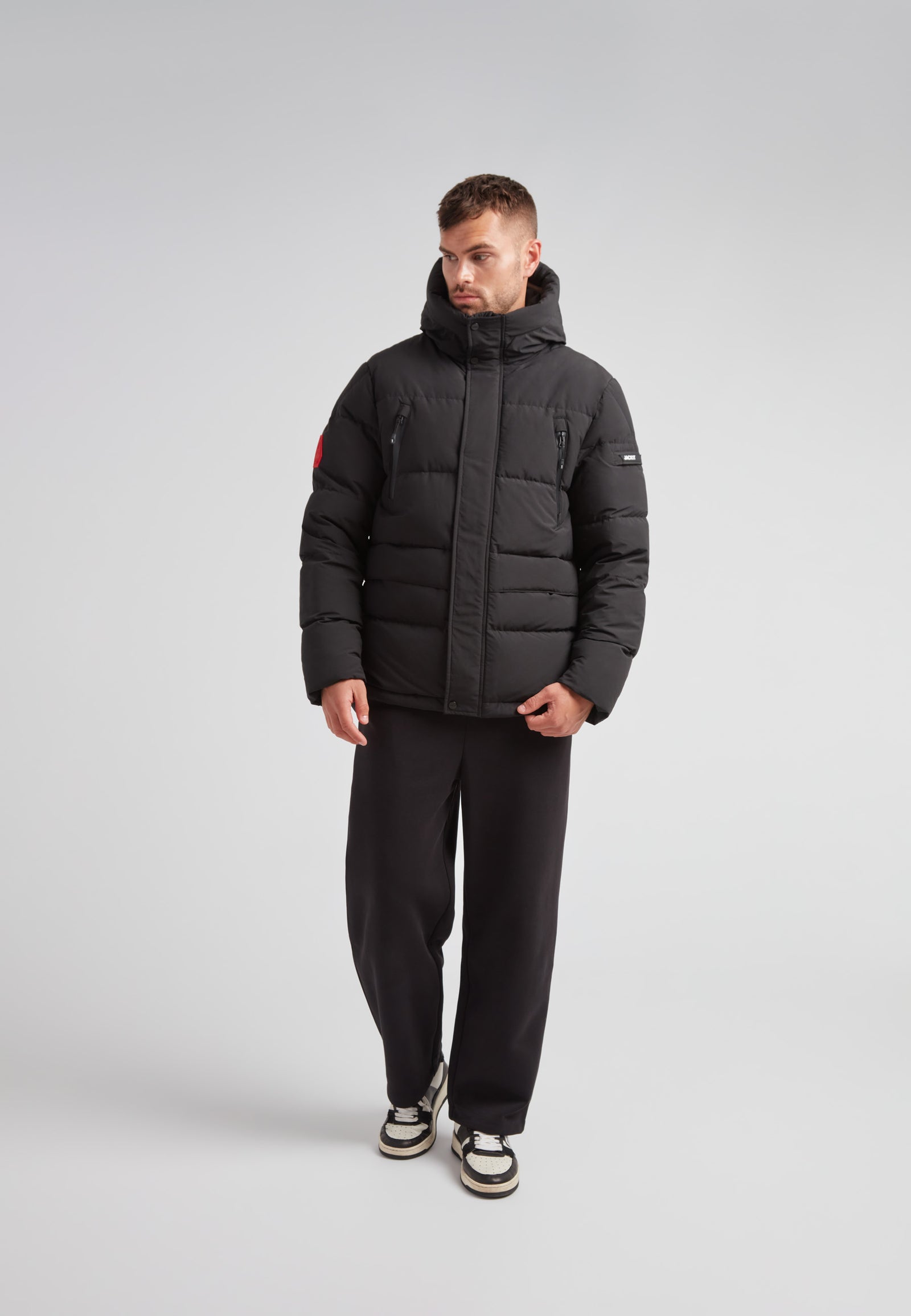 EZ Frontier Prime Down Puffer Jacket Matt Black worn by a model in a studio setting.