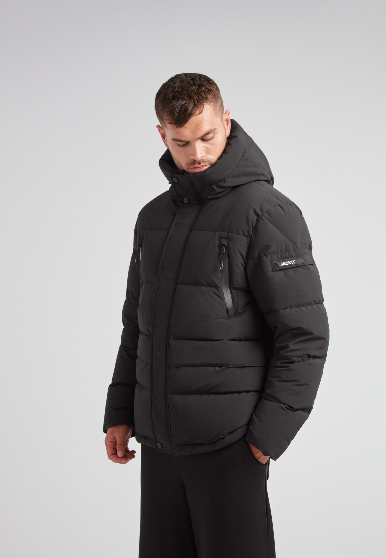 EZ Frontier Prime Down Puffer Jacket Matt Black worn by a model showing modern silhouette and winter utility features.