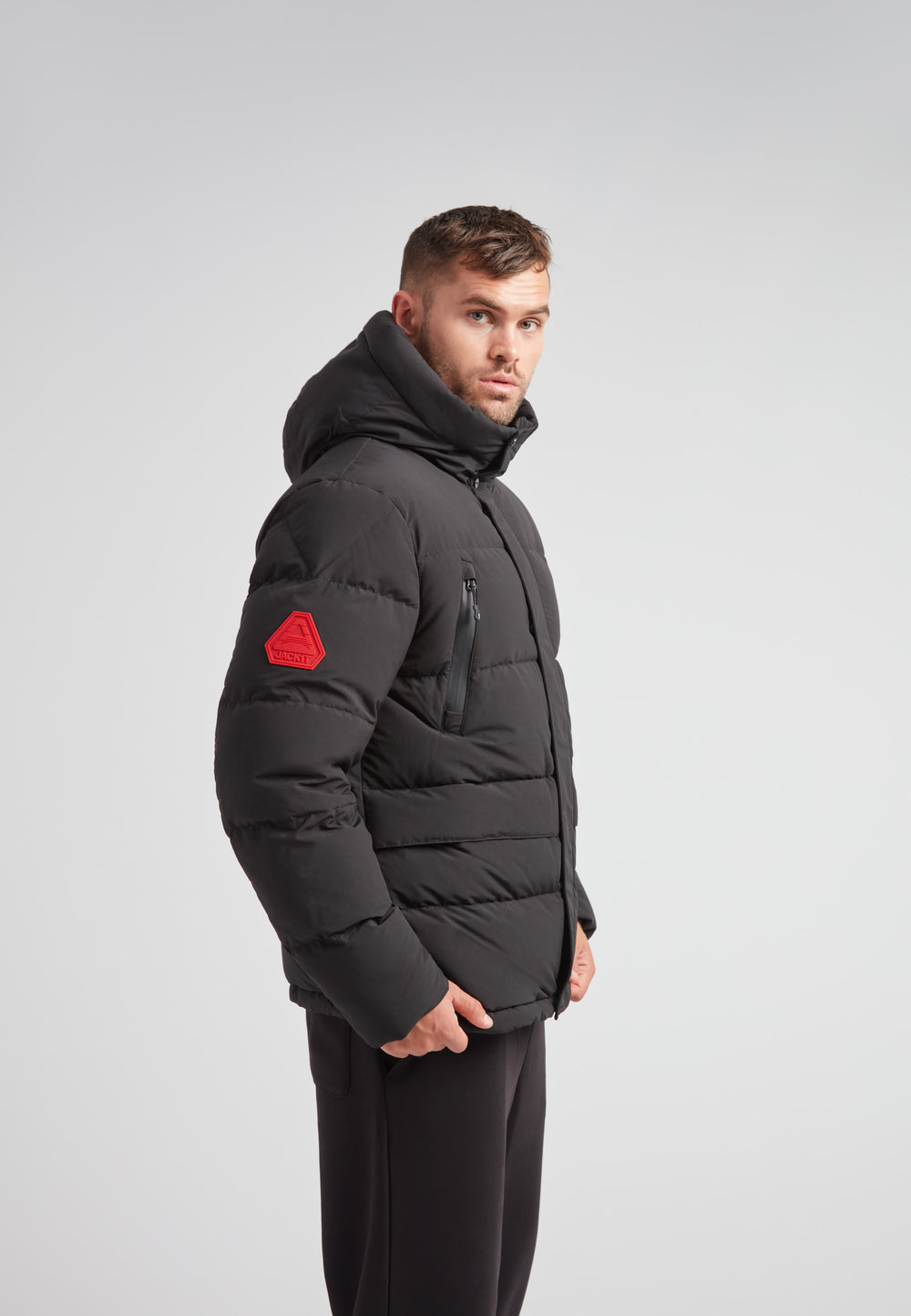 EZ Frontier Prime Down Puffer Jacket Matt Black worn on a model, showcasing the modern silhouette and design details.