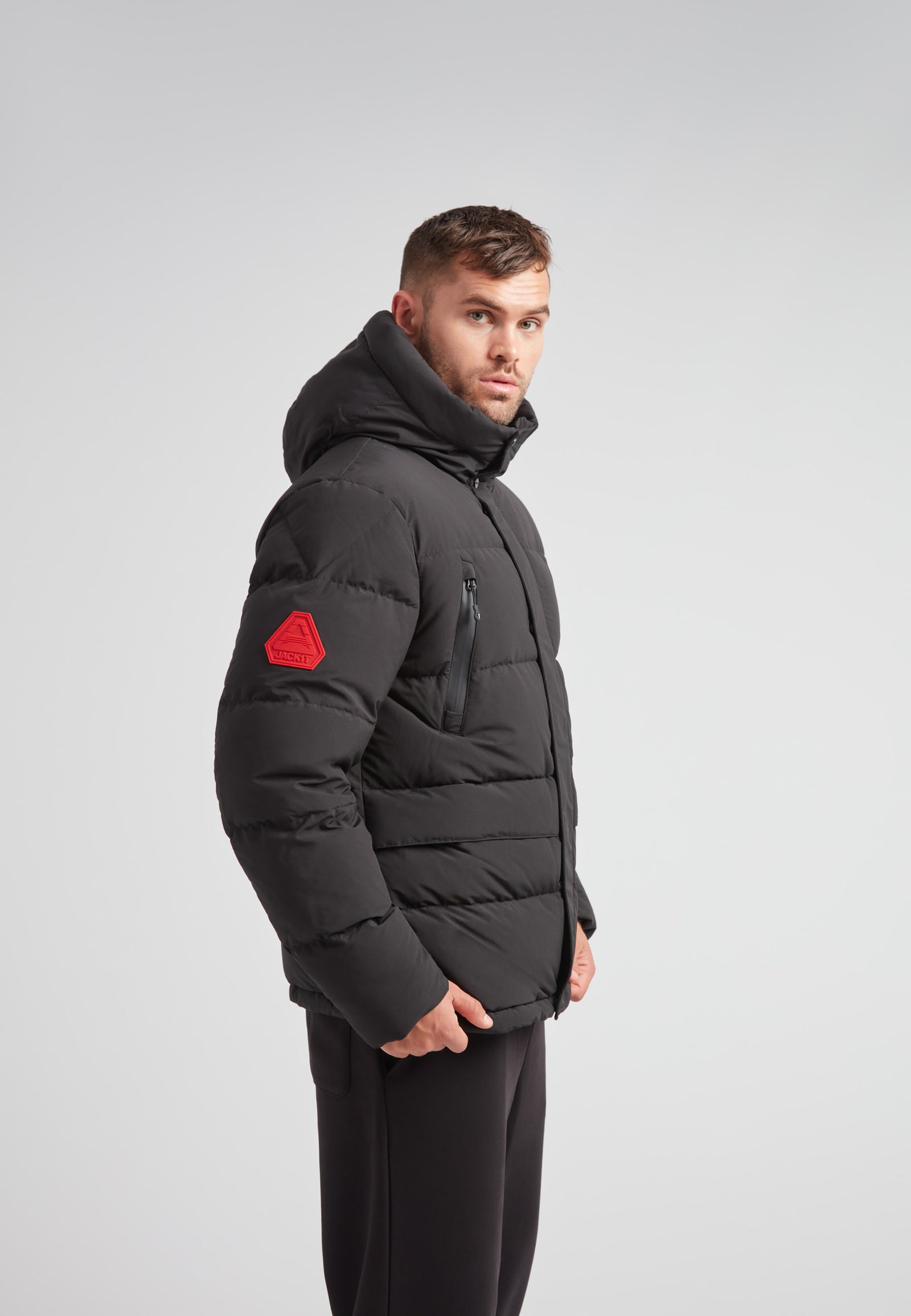 EZ Frontier Prime Down Puffer Jacket Matt Black worn on a model, showcasing the modern silhouette and design details.