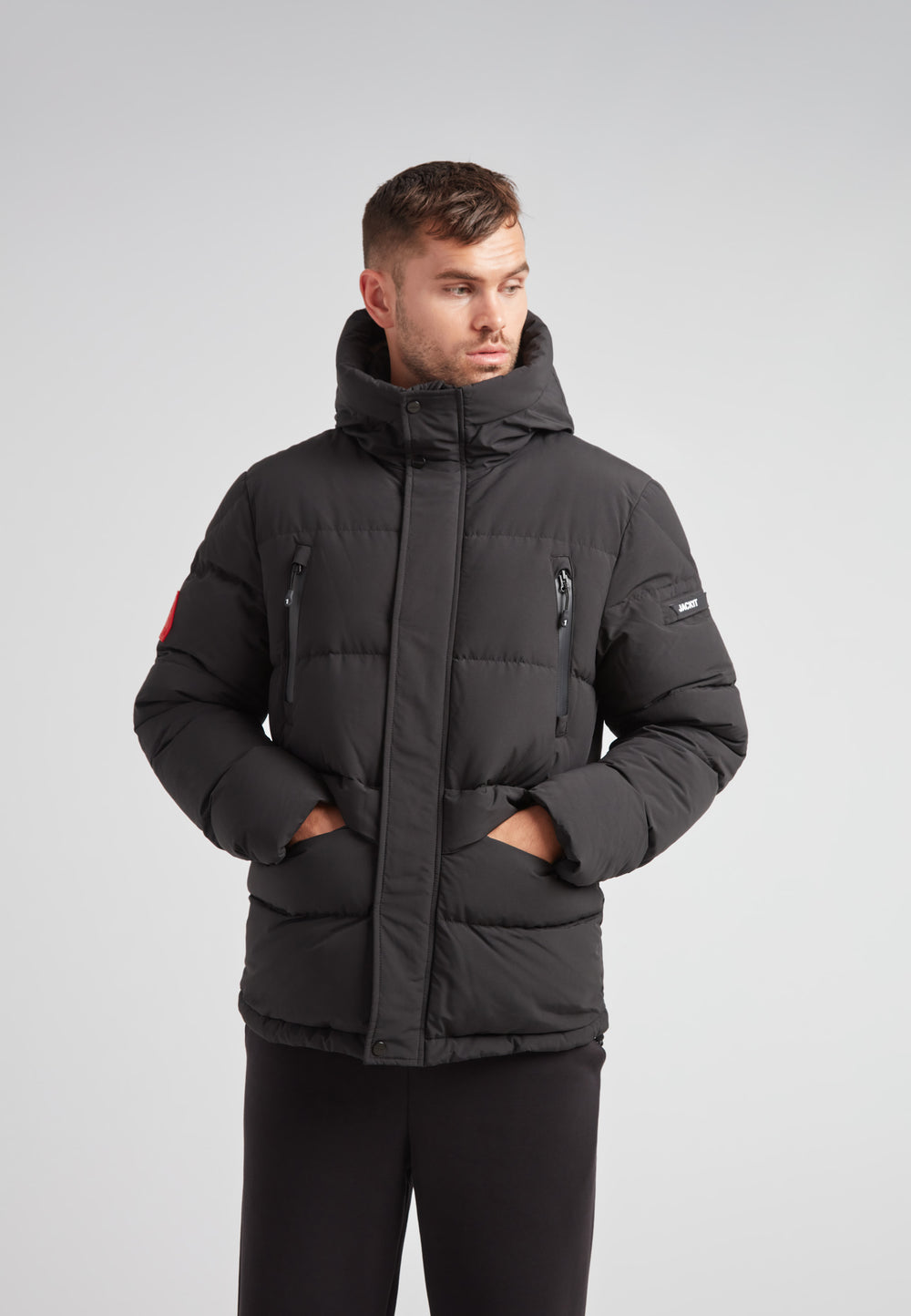 EZ Frontier Prime Down Puffer Jacket Matt Black worn by a model, showcasing modern urban winter style and functionality.