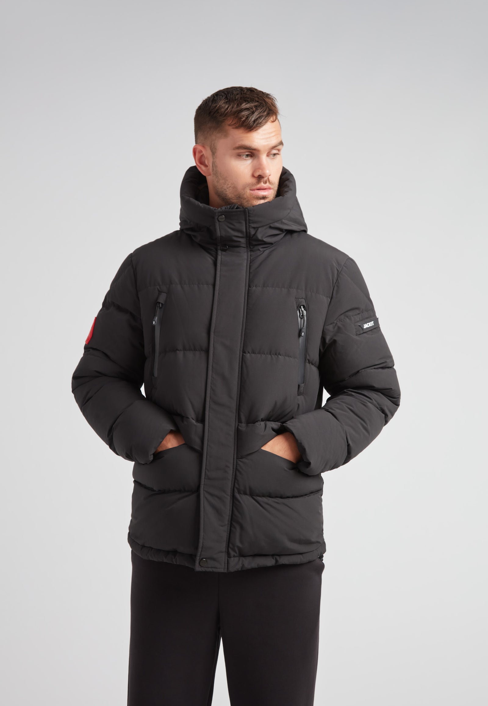 EZ Frontier Prime Down Puffer Jacket Matt Black worn by a model, showcasing modern urban winter style and functionality.