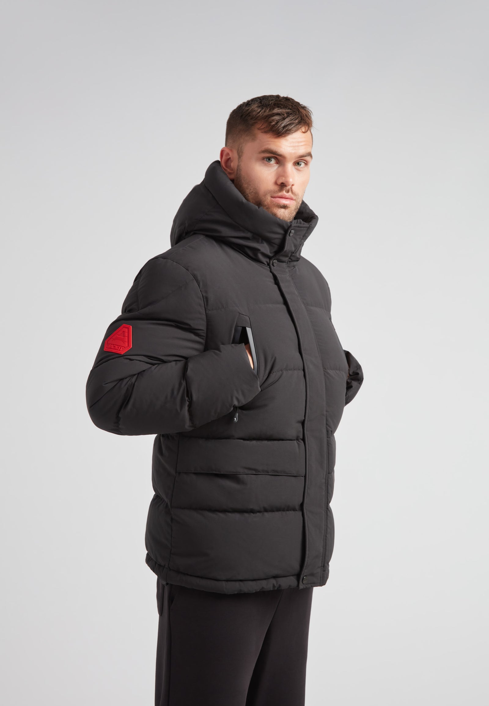 EZ Frontier Prime Down Puffer Jacket Matt Black on model with a modern fit and hood, featured in a sleek design.