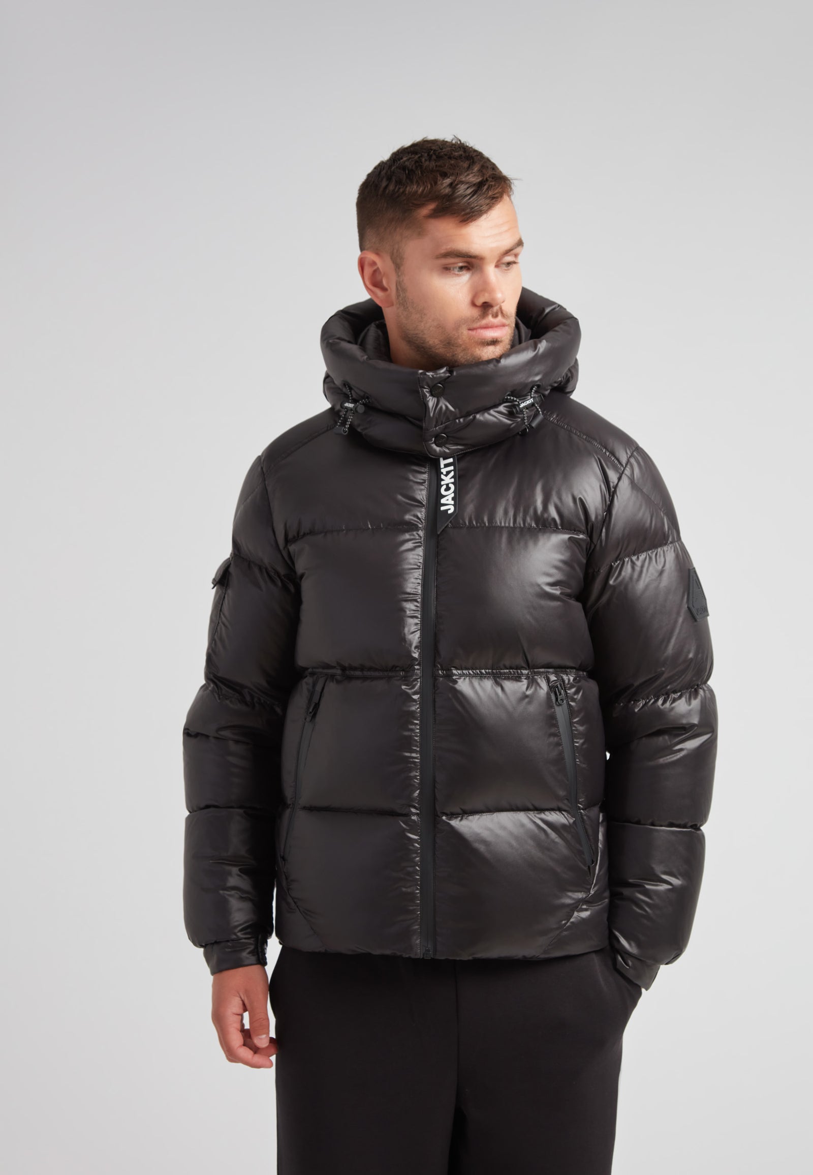 EZ Water Puffer Racer Jacket Lux Black worn by model, showcasing stylish winter outerwear for men.