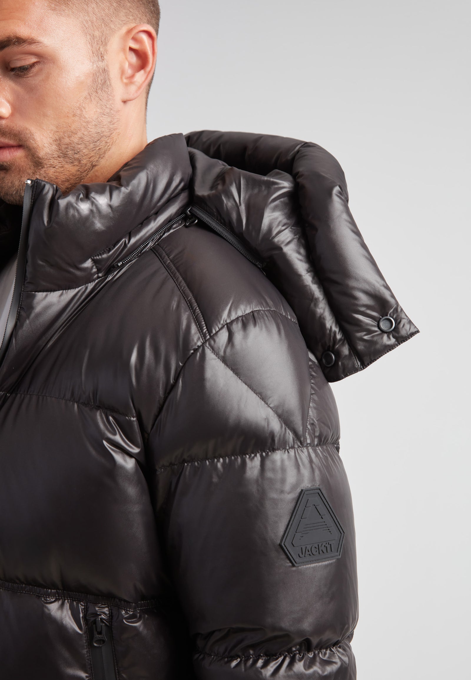 Model wearing the EZ Water Puffer Racer Jacket Lux Black showcasing its sleek design and water-resistant features.