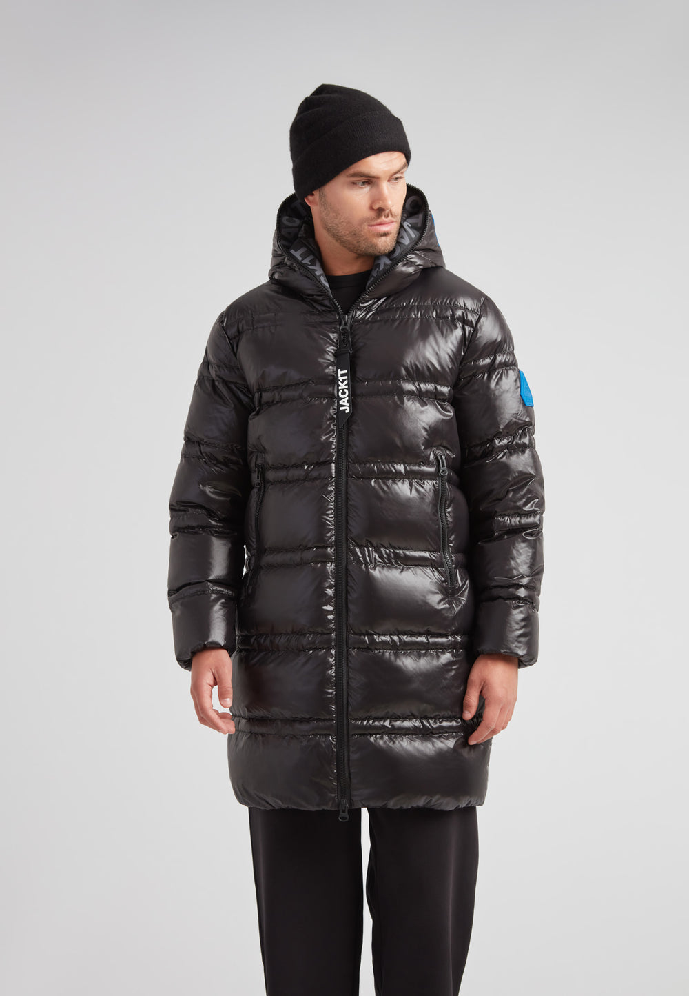R4D Tramline Puffer Coat Lux Black on a model showcasing its stylish design for cold weather.