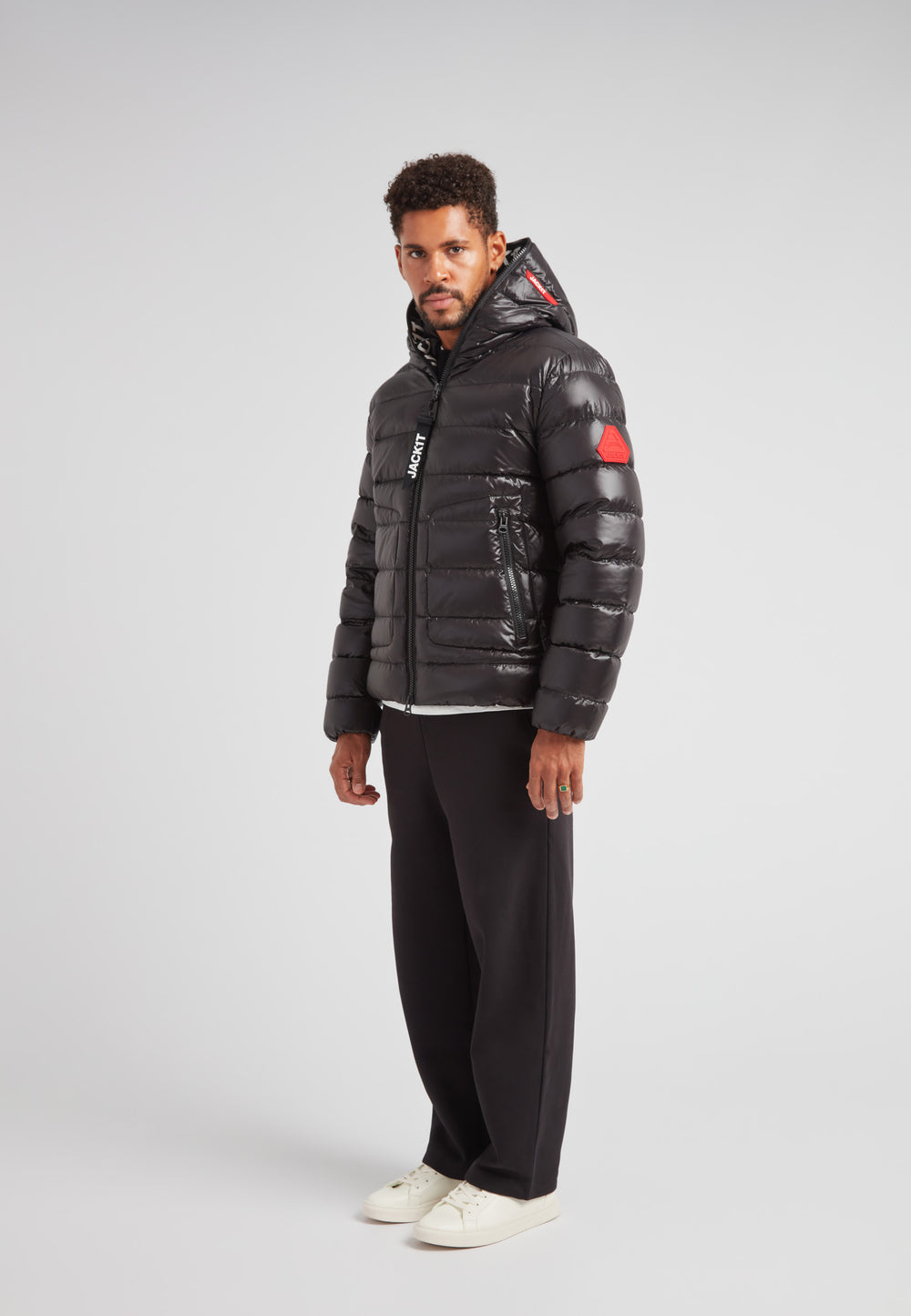 R4D Tramline Puffer Racer Jacket Lux Black on model, showcasing warm and stylish outerwear for modern city movement.