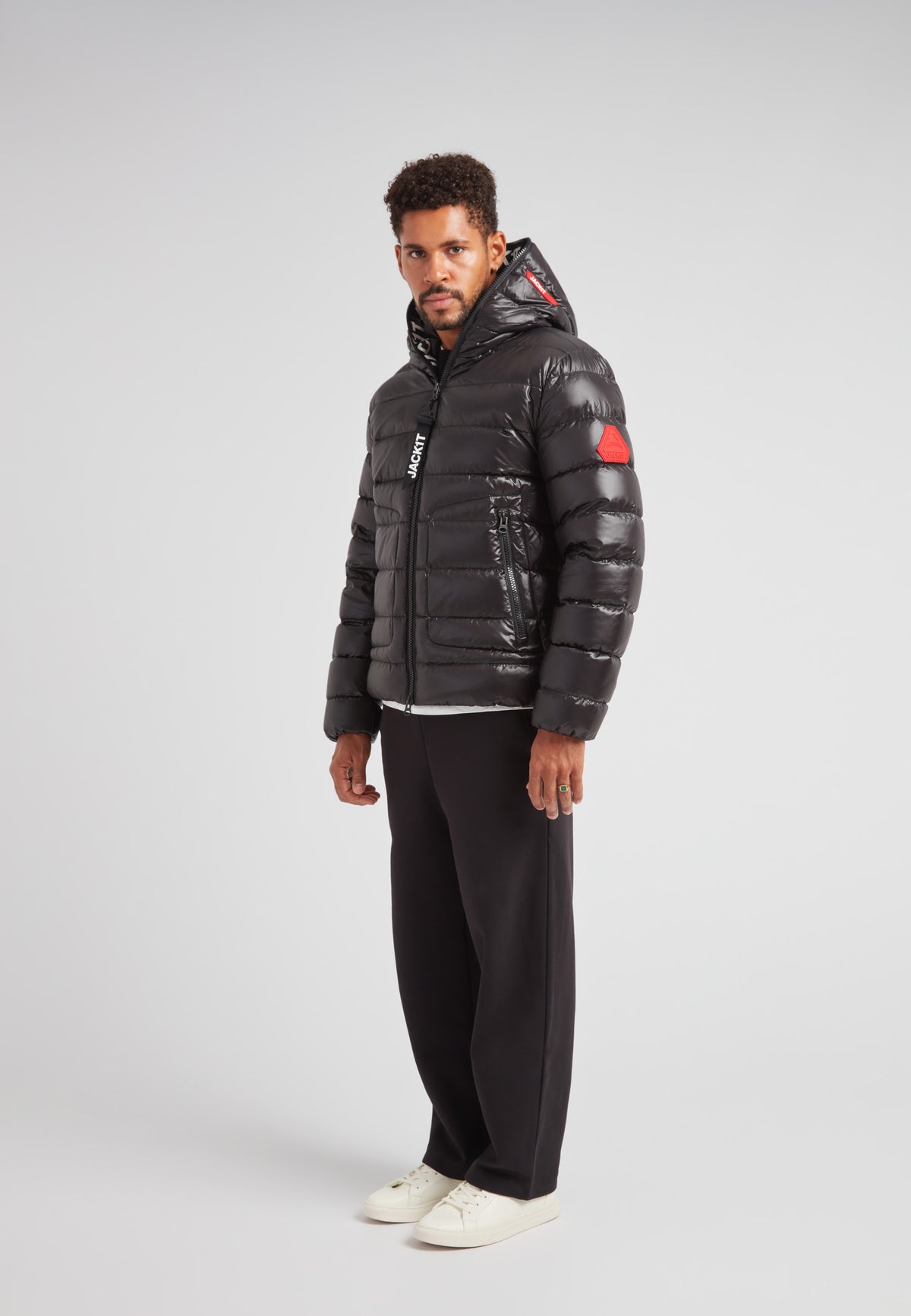 R4D Tramline Puffer Racer Jacket Lux Black on model, showcasing warm and stylish outerwear for modern city movement.