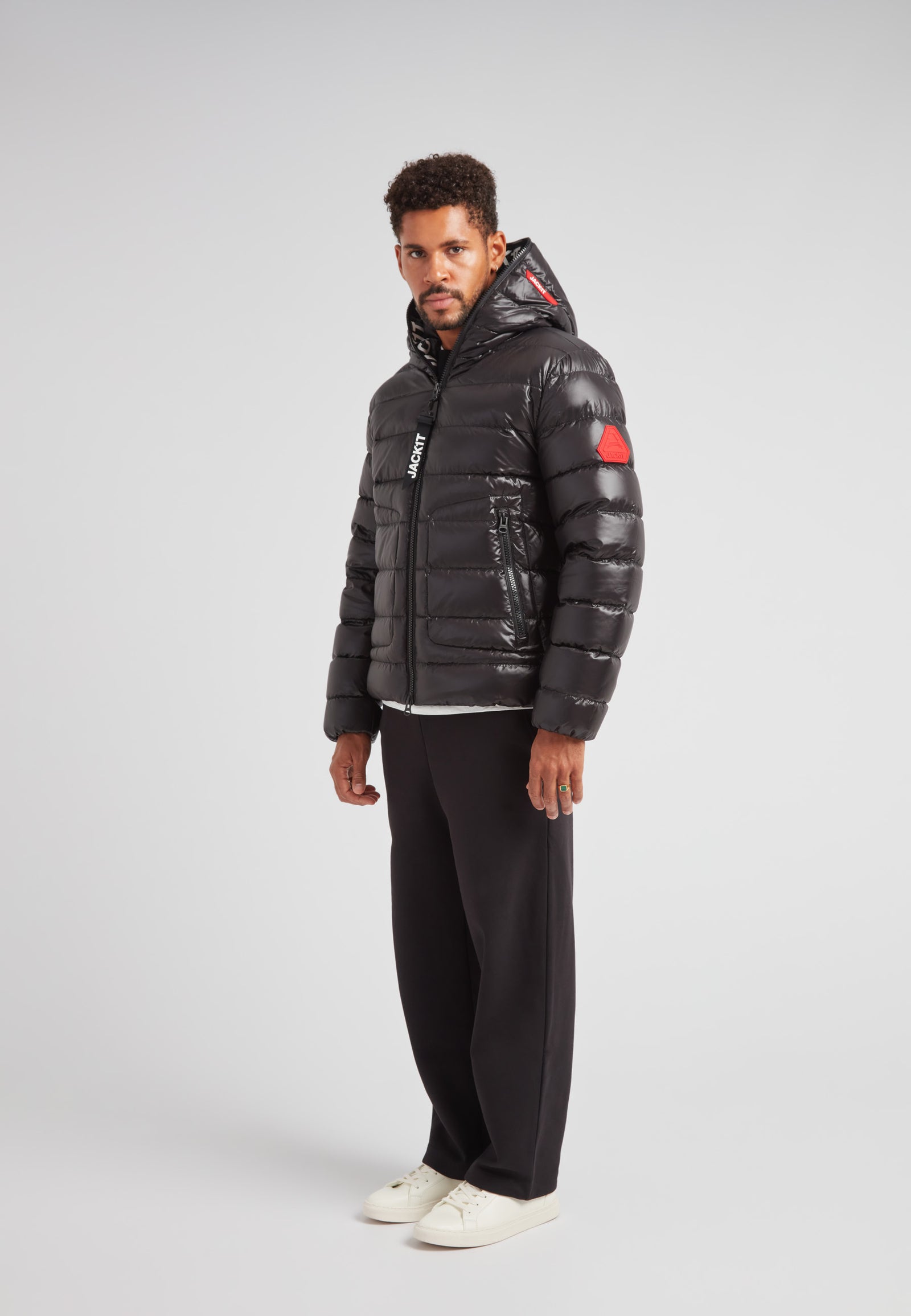 R4D Tramline Puffer Racer Jacket Lux Black on model, showcasing warm and stylish outerwear for modern city movement.
