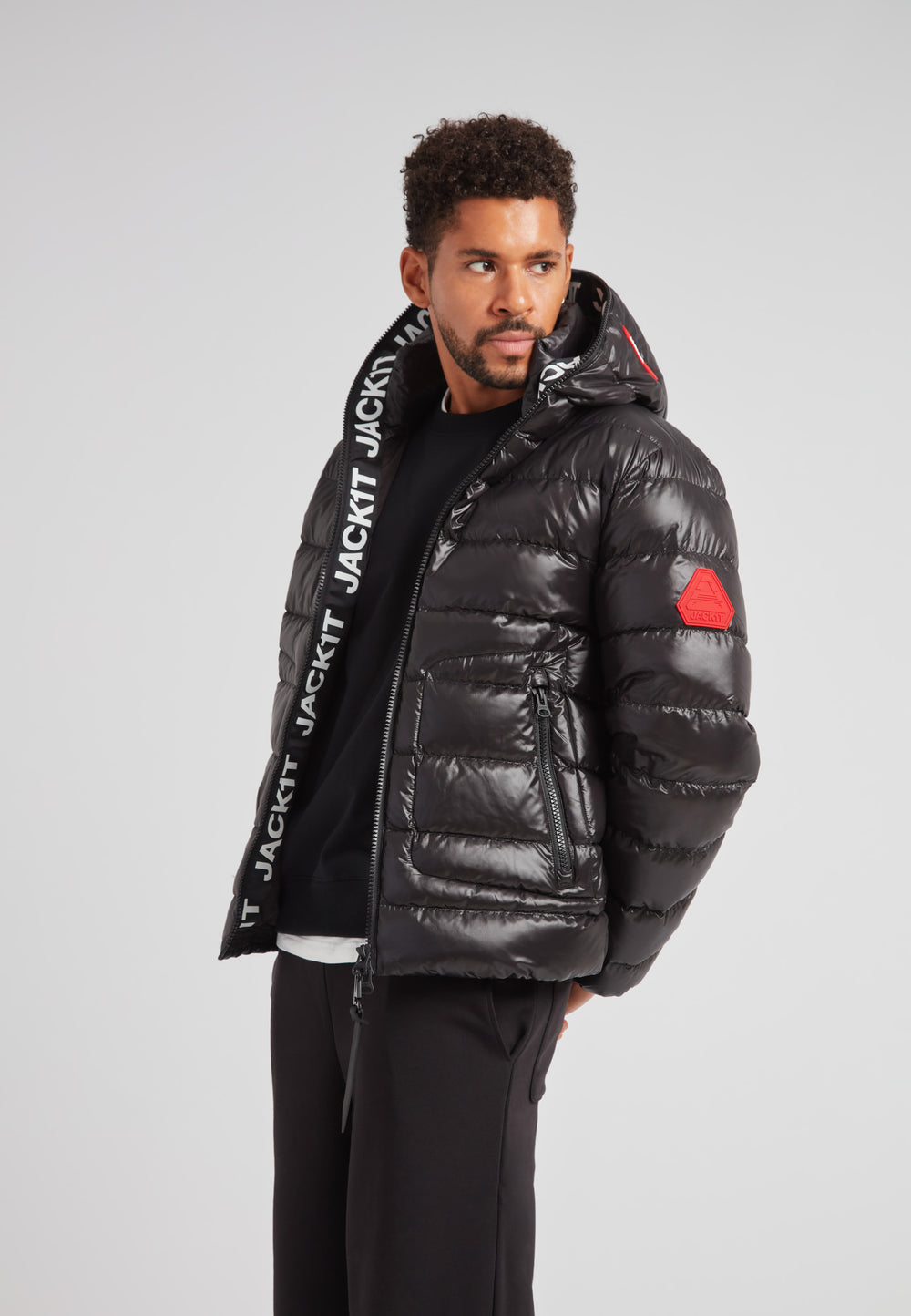 R4D Tramline Puffer Racer Jacket Lux Black worn by a model showcasing its sleek design and comfort.