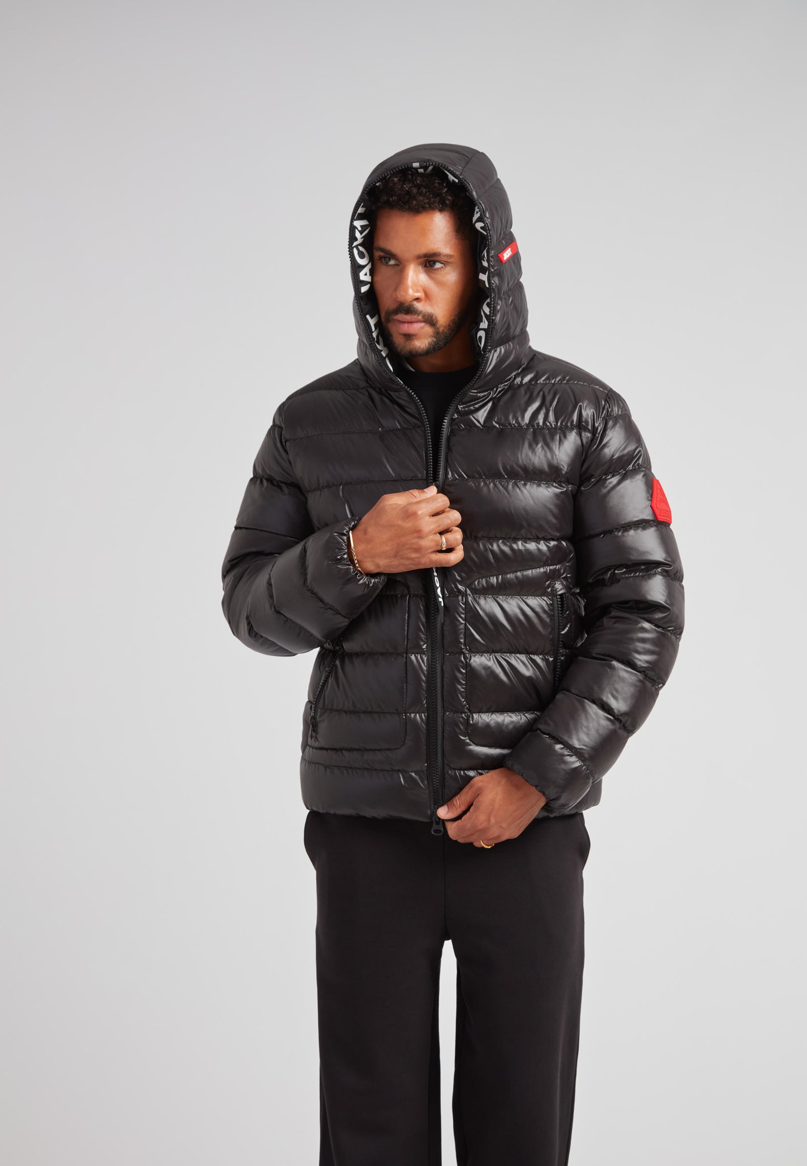 R4D Tramline Puffer Racer Jacket Lux Black on model showcasing modern, sleek design and performance materials.