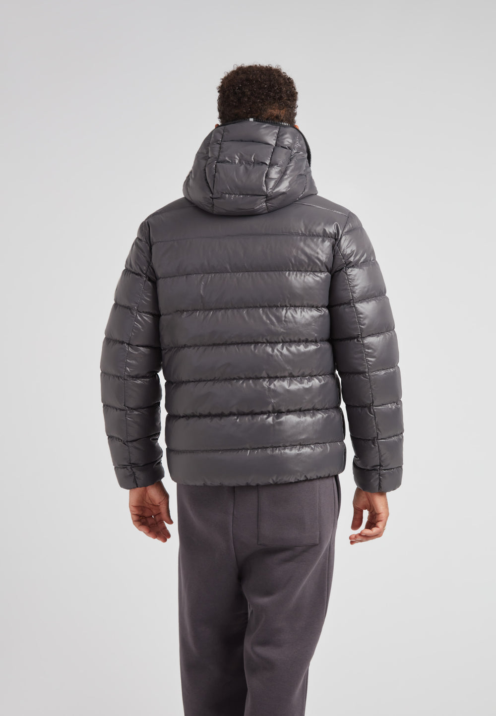 R4D Tramline Puffer Racer Jacket Lux Graphite shown from the back, highlighting its sleek design and hood.