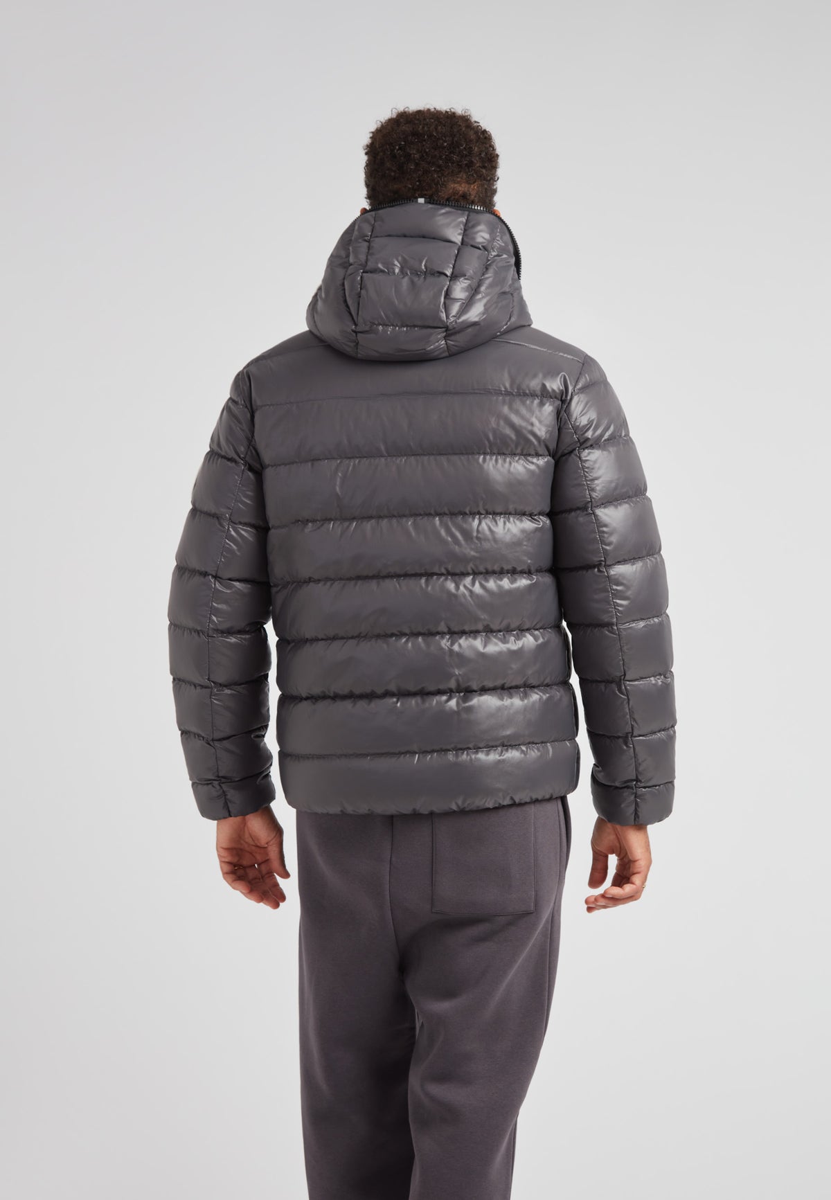 R4D Tramline Puffer Racer Jacket Lux Graphite shown from the back, highlighting its sleek design and hood.