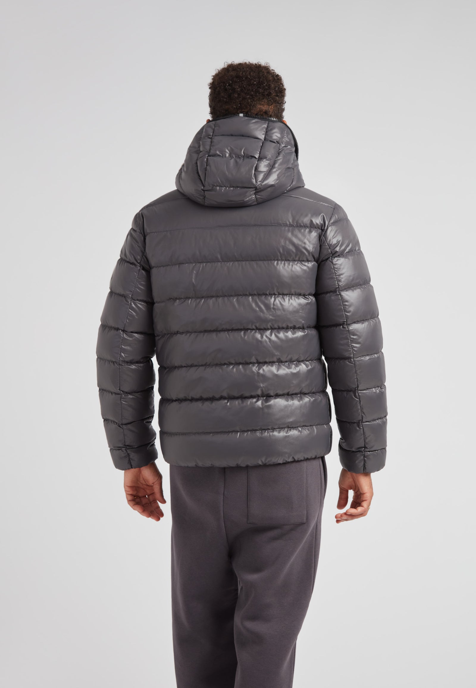 R4D Tramline Puffer Racer Jacket Lux Graphite shown from the back, highlighting its sleek design and hood.