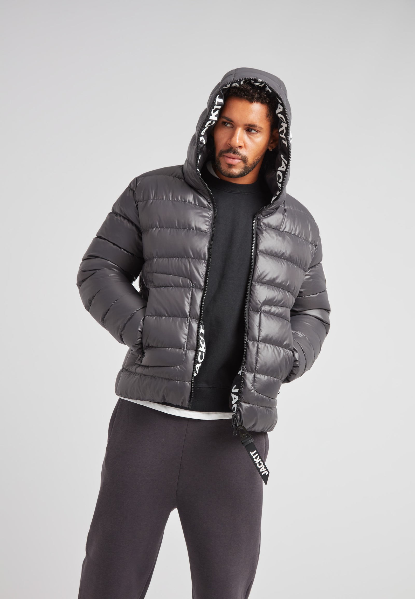 R4D Tramline Puffer Racer Jacket Lux Graphite on model showcasing its stylish design and warmth.