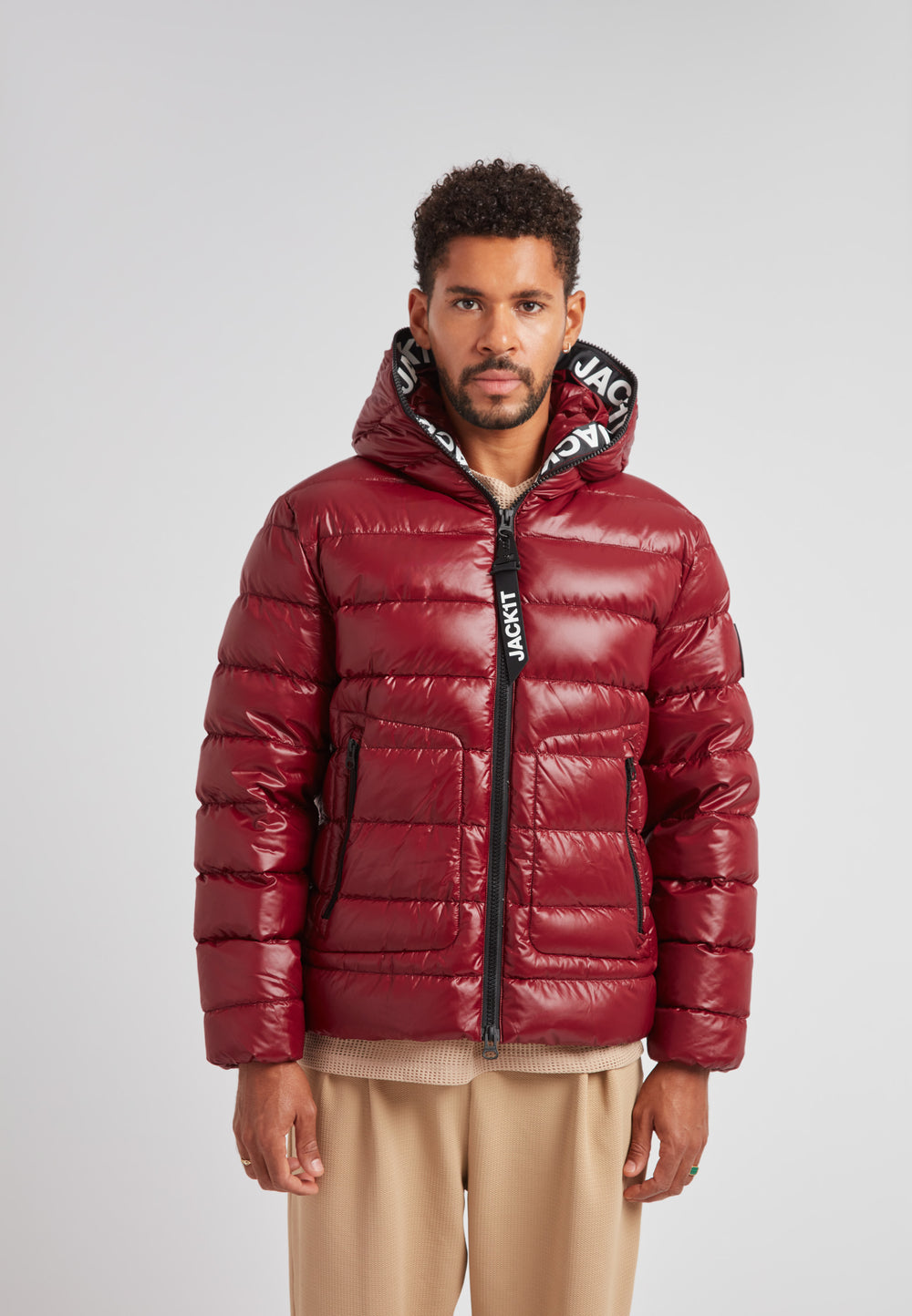 R4D Tramline Puffer Racer Jacket Lux Red worn by a model, showcasing its sleek design and vibrant red color.