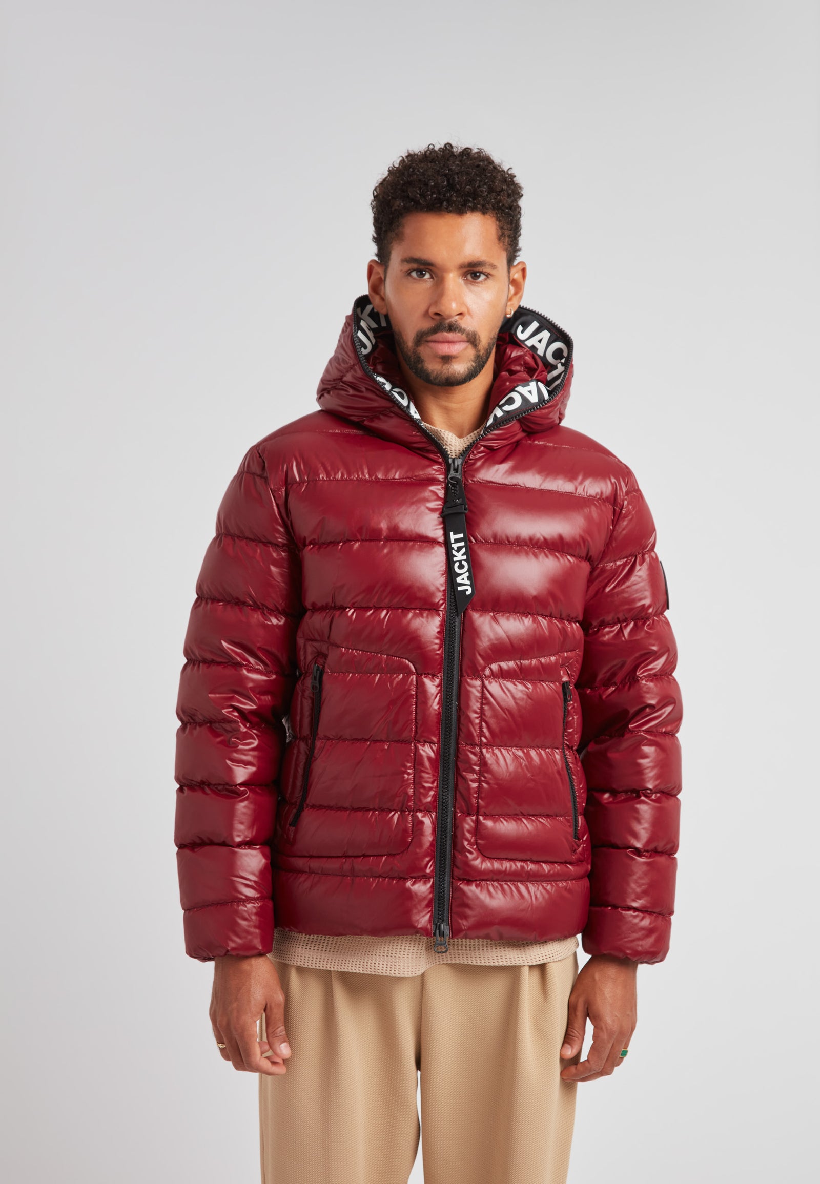 R4D Tramline Puffer Racer Jacket Lux Red worn by a model, showcasing its sleek design and vibrant red color.