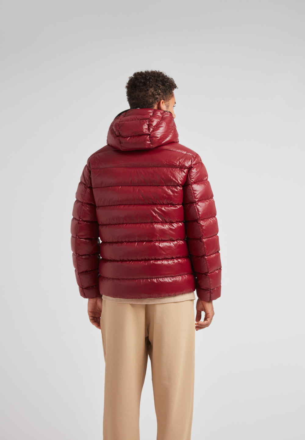 R4D Tramline Puffer Racer Jacket Lux Red shown on a model from the back, showcasing its sleek design and luxurious material.