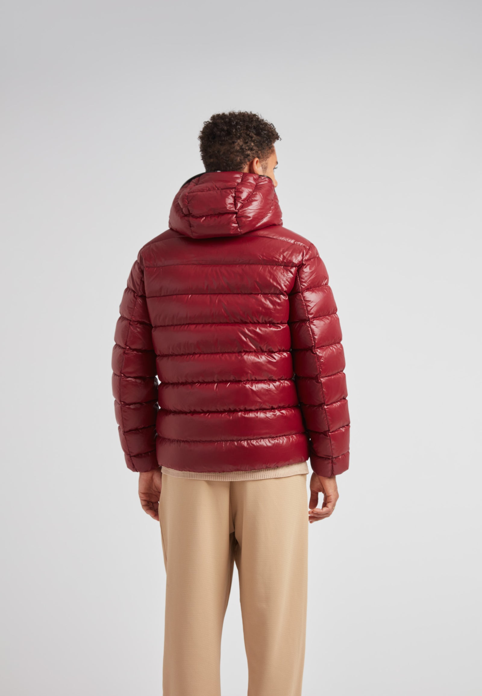 R4D Tramline Puffer Racer Jacket Lux Red shown on a model from the back, showcasing its sleek design and luxurious material.