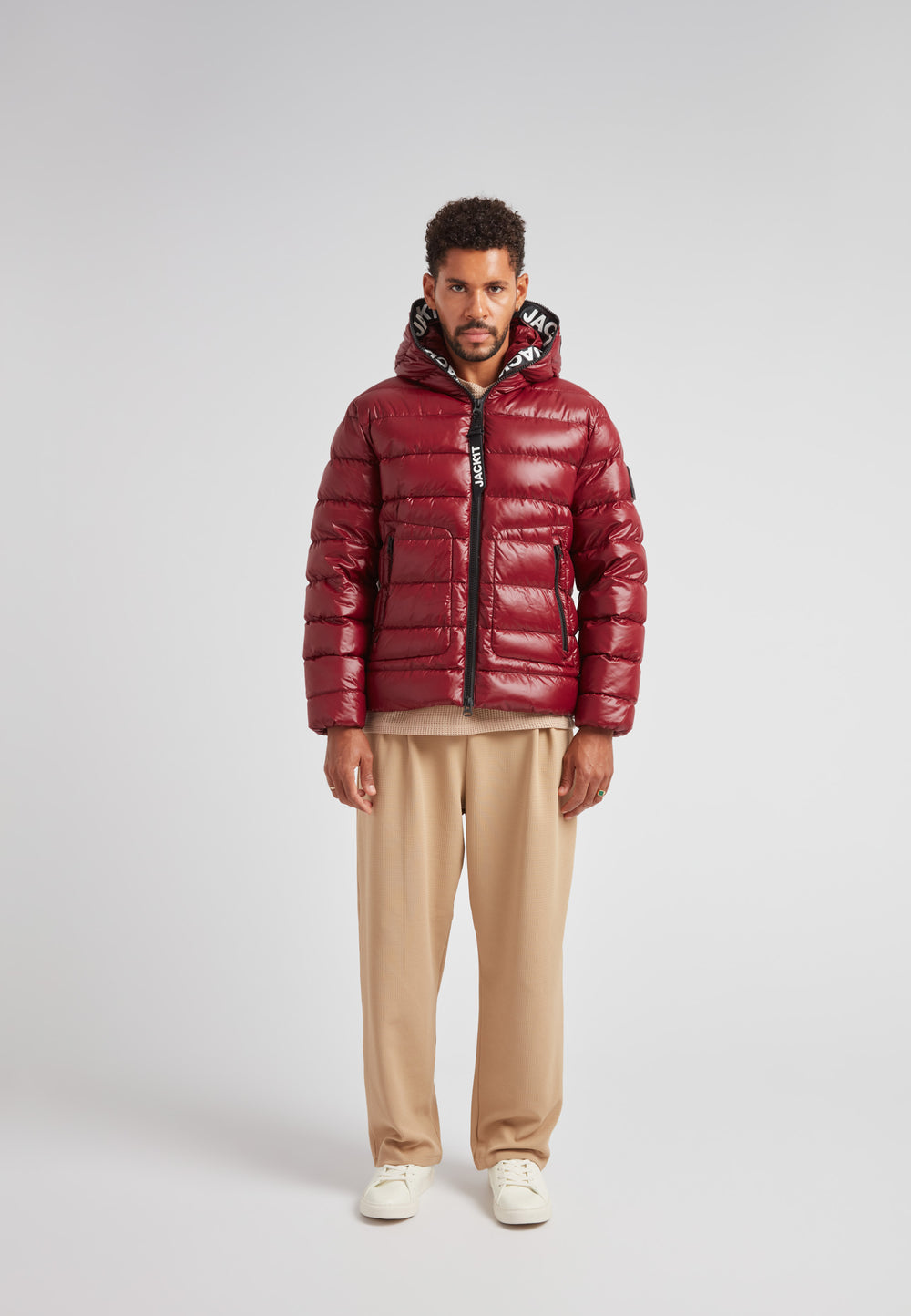 R4D Tramline Puffer Racer Jacket Lux Red displayed on model in a studio setting, showcasing its sleek design and luxurious color.