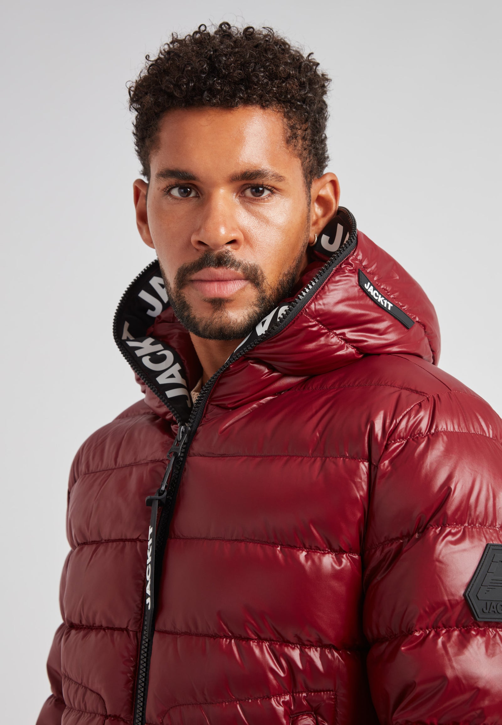 R4D Tramline Puffer Racer Jacket Lux Red worn by a model, showcasing its stylish design and vibrant color.