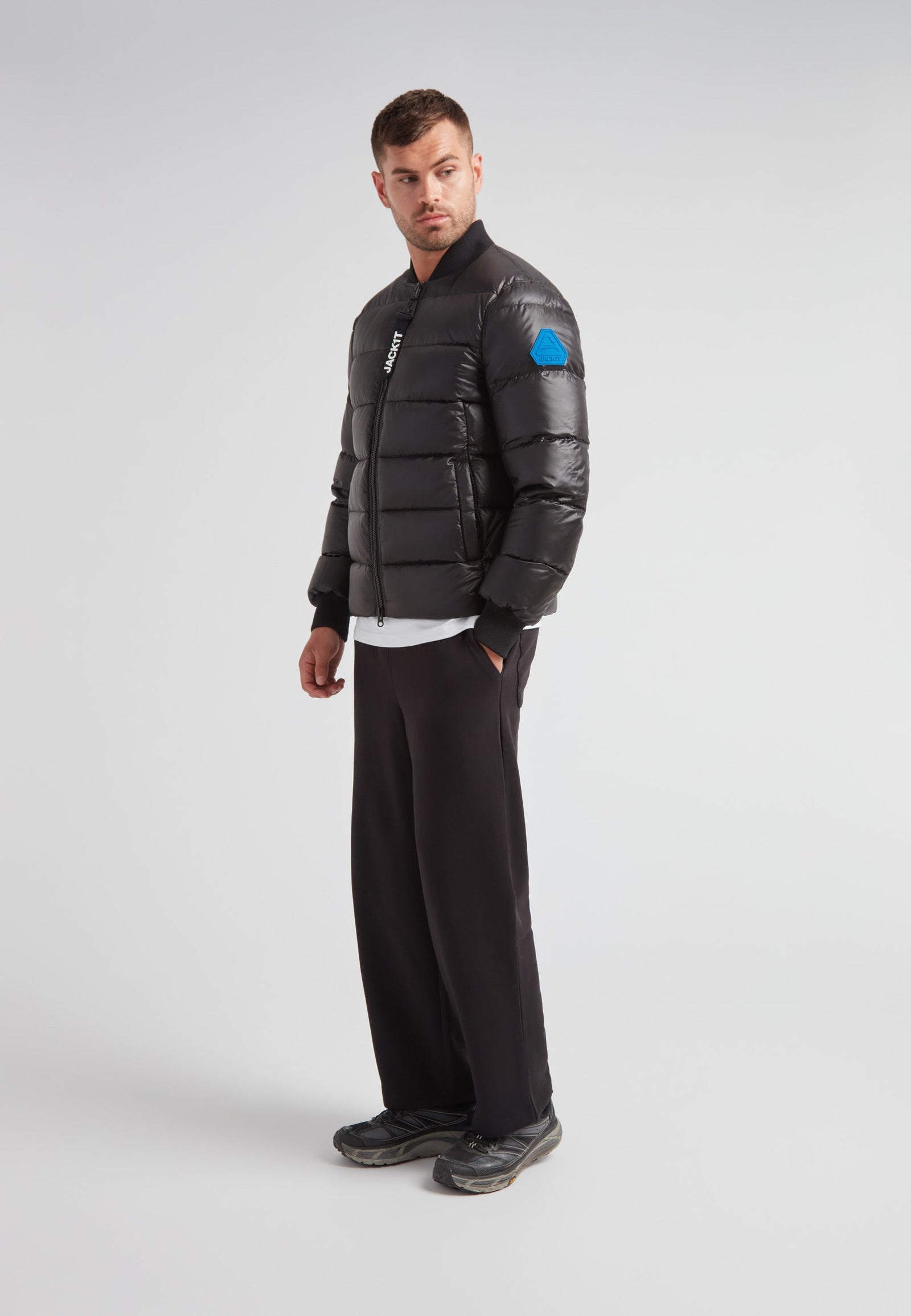 Man wearing a Vortex Black Bomber Jacket, featuring a modern design and durable material, stylish and functional.