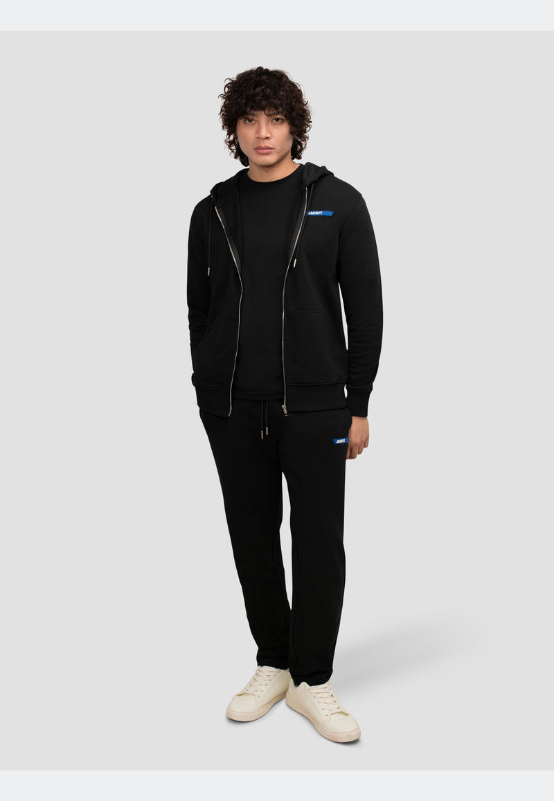 Model wearing a black hoodie zip through, paired with matching joggers for a stylish, comfortable look.