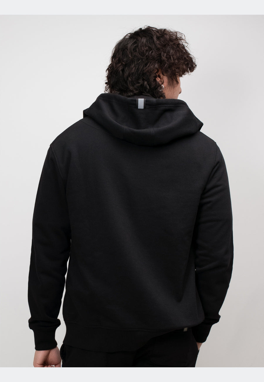Model showcasing the back view of a black hoodie, featuring a relaxed fit and structured design.