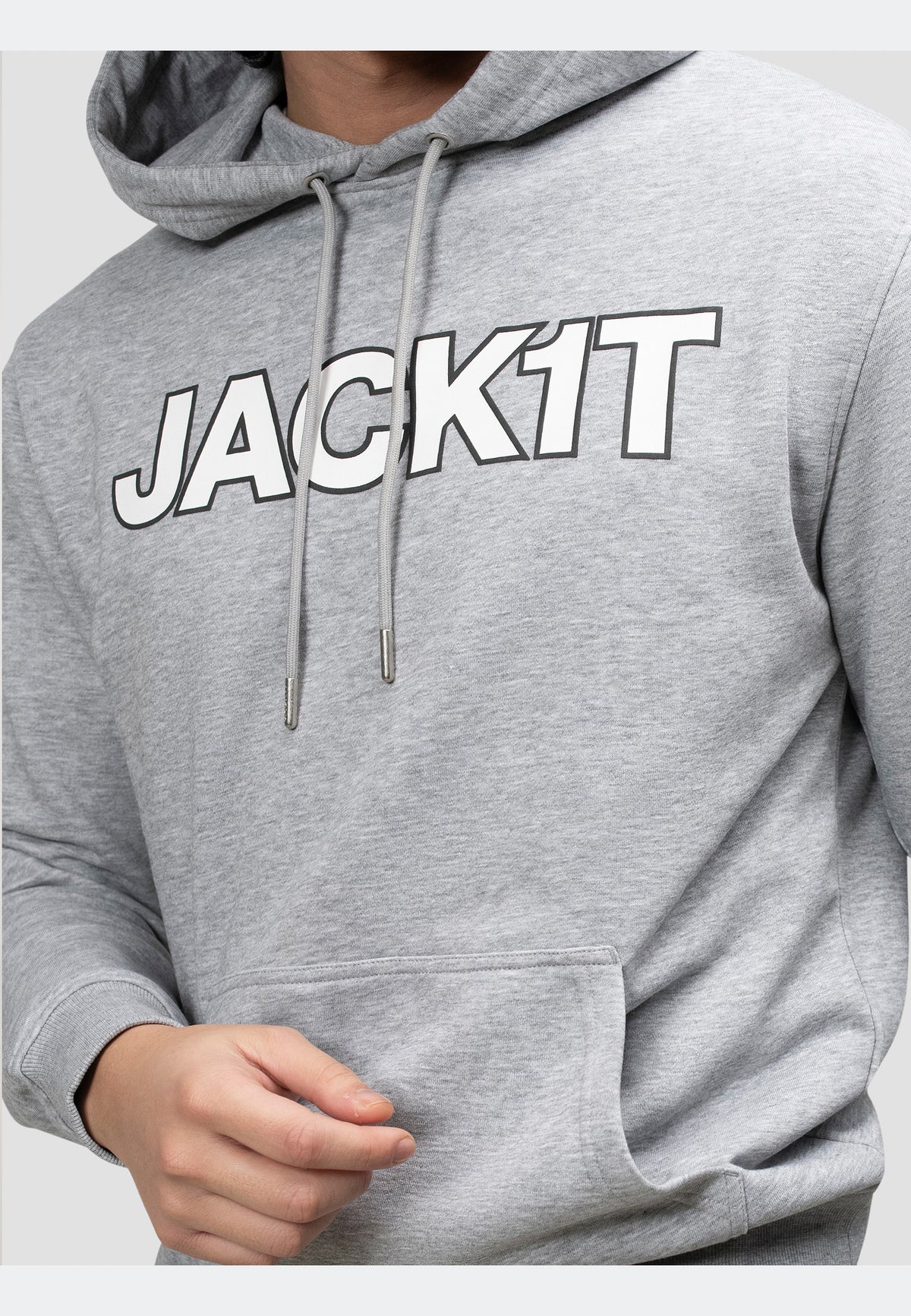 Close-up of a grey hoodie with 'JACK1T' printed on the front, showcasing relaxed street style.