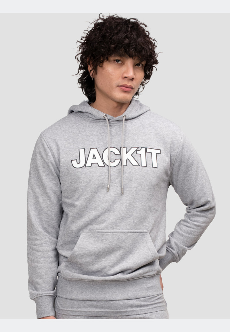 Model wearing a grey hoodie featuring a bold 'JACKIT' print, combining style and comfort.