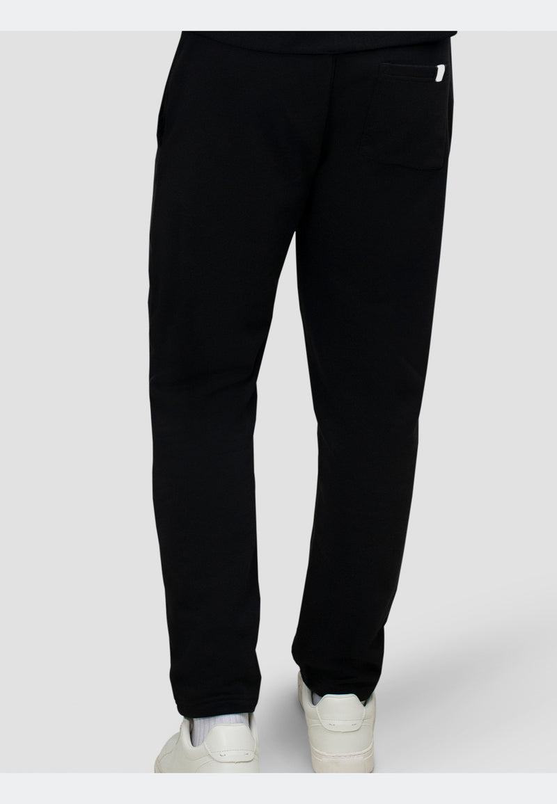 Back view of black joggers featuring a straight-leg silhouette and elasticated waistband.