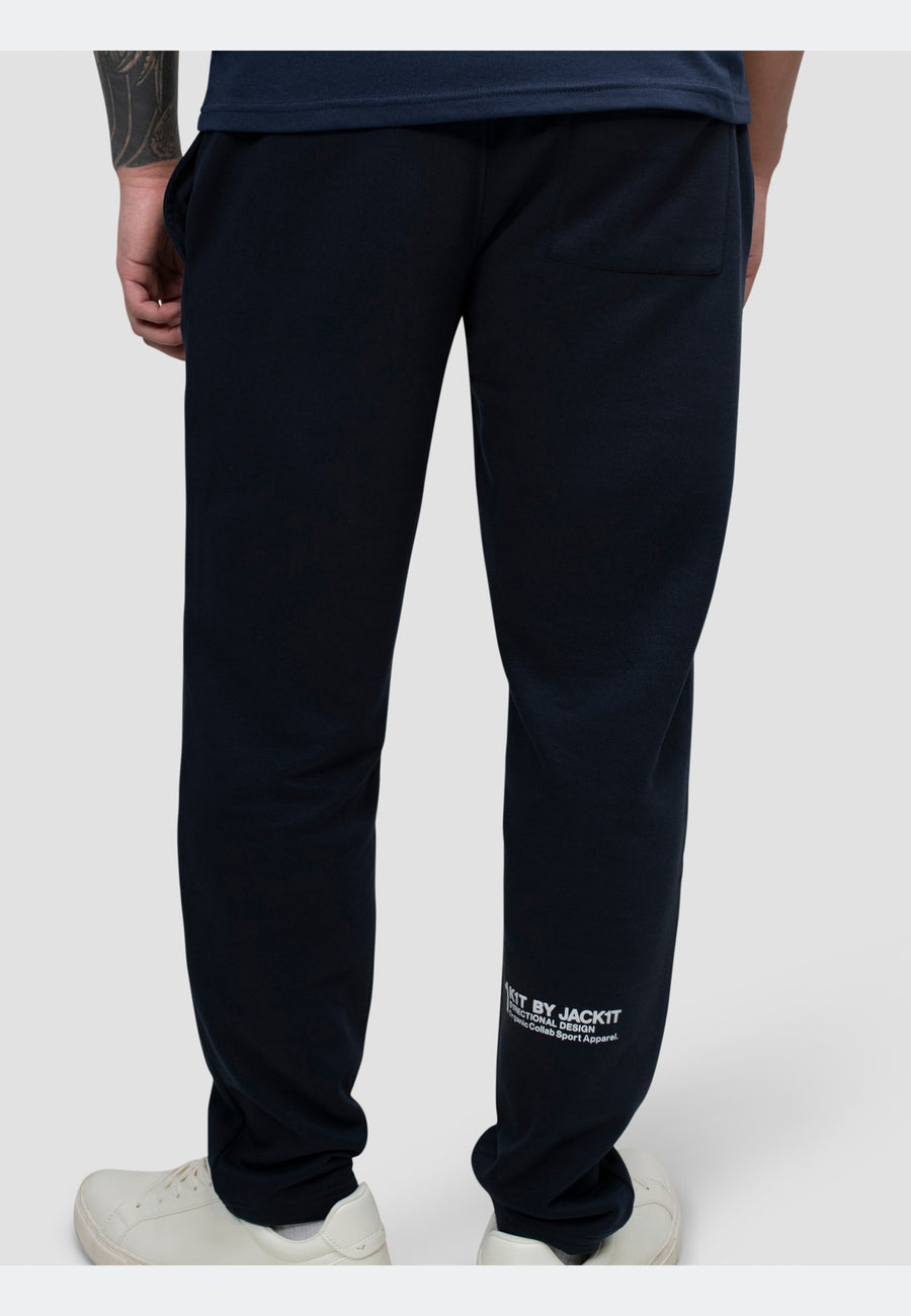 Man wearing navy joggers showing the back view, featuring a relaxed fit and straight-leg style.