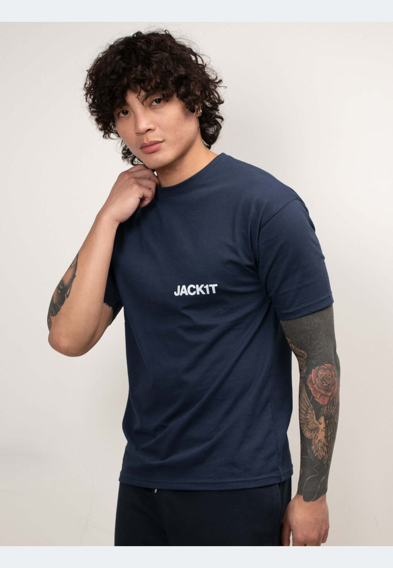 Model wearing a navy t-shirt with a modern fit and logo, showcasing casual style and comfort.