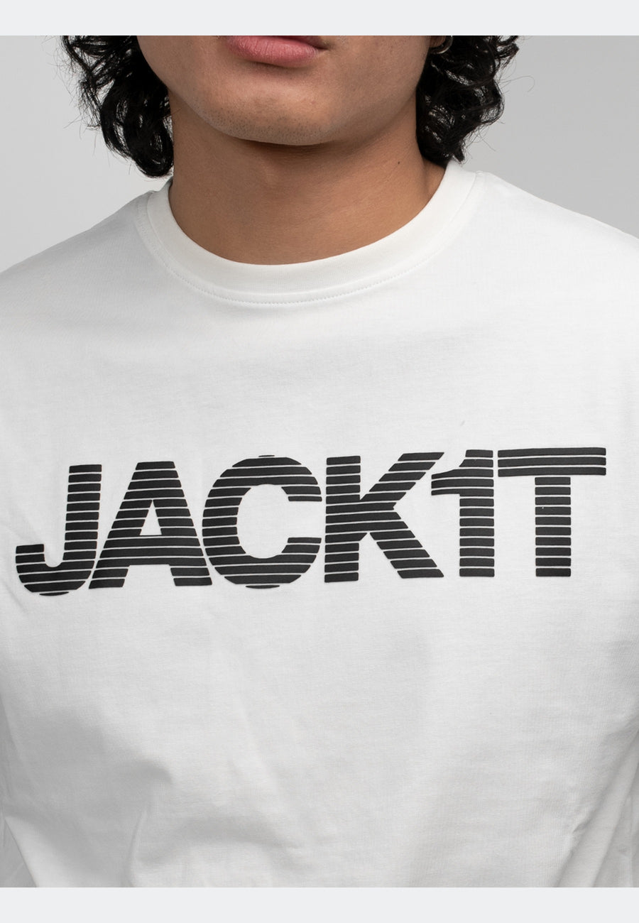 Model wearing off white t-shirt with bold 'JACK1T' graphic on the front, showcasing a stylish casual look.