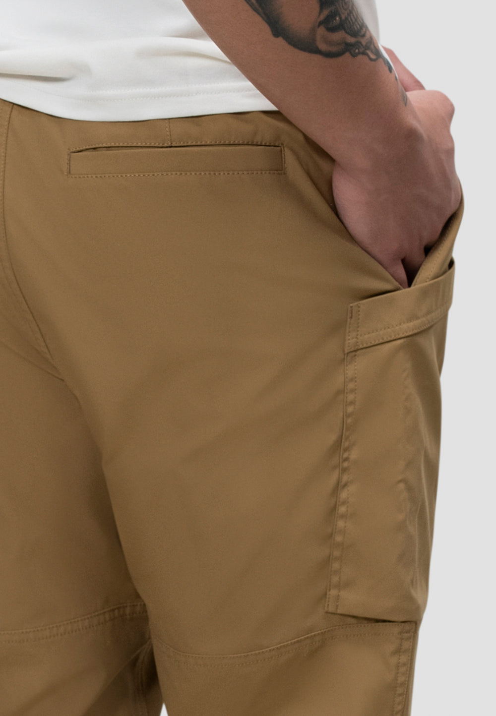 Men's sand cargo trousers showcasing pocket design and relaxed fit for everyday comfort.