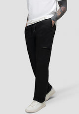 Model wearing men's black cargo trousers with elastic waist and relaxed fit for everyday comfort.