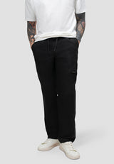 Model wearing men's black cargo trousers with elastic waist for comfort and relaxed fit.