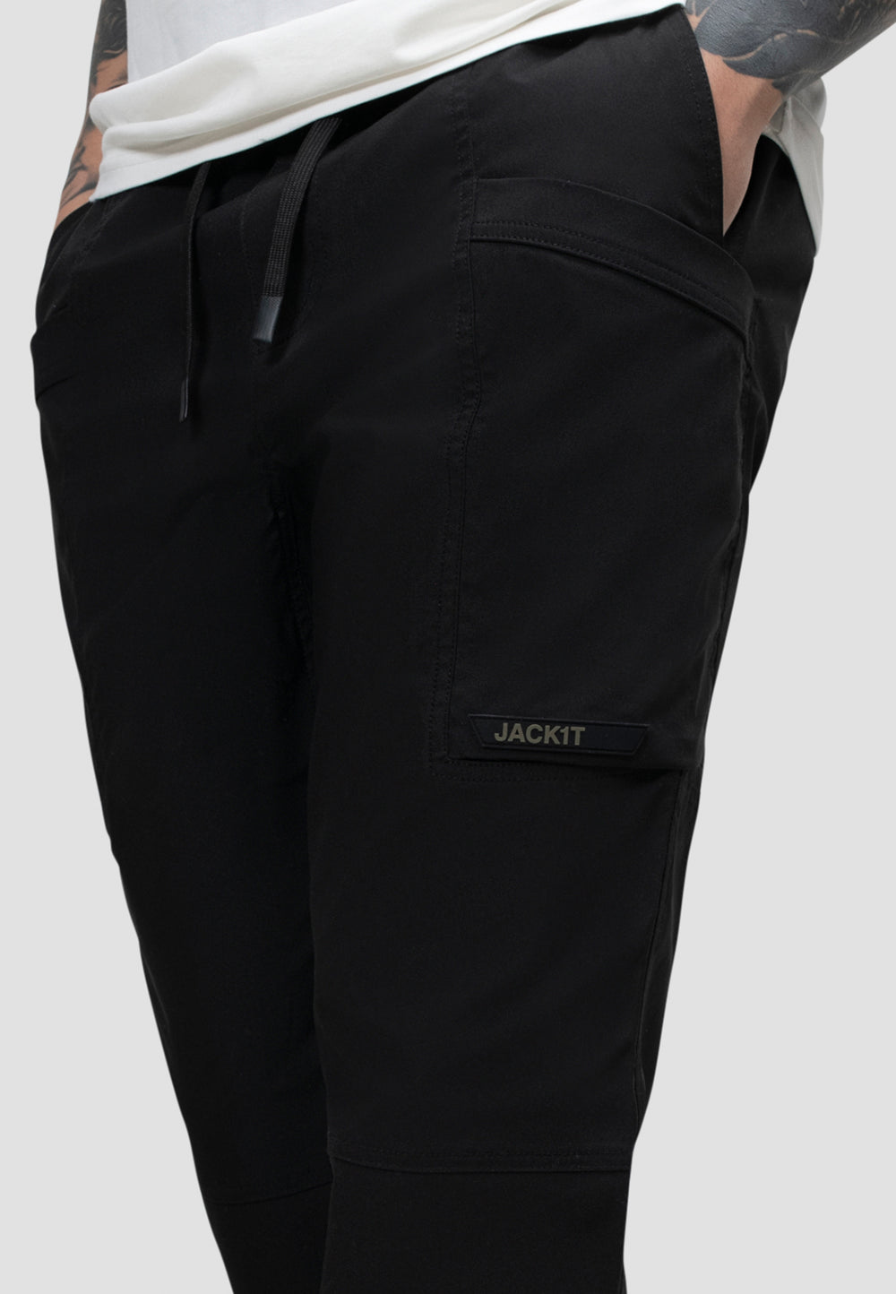 Men's black cargo trousers with elastic waist and relaxed fit, perfect for everyday wear and travel.
