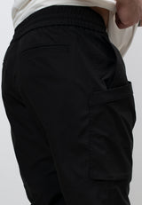 Mens Technical Black Cargo Trousers showing elasticated waist and side pockets for practical use.